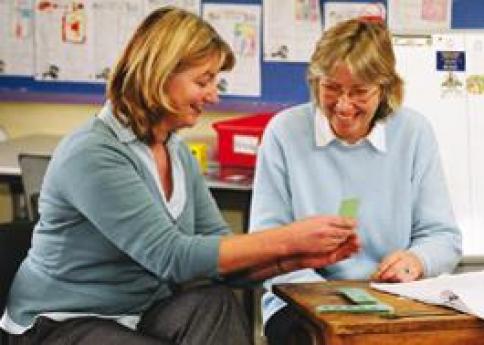 Two teachers working together in a classroom setting